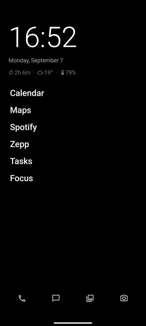 Home screen: clock, date, a plain list of apps and a four-app dock